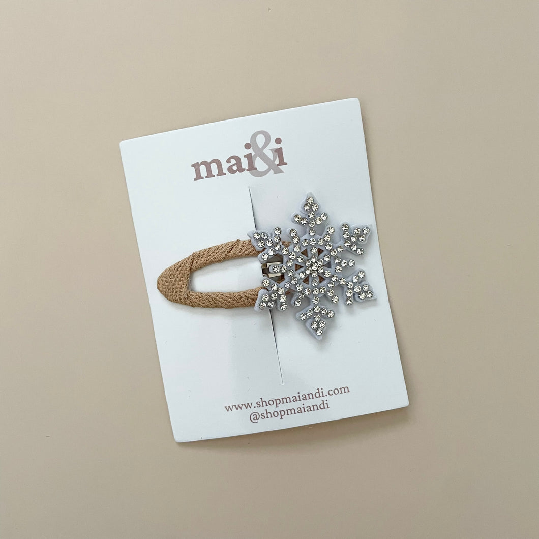 tan snowflake clip