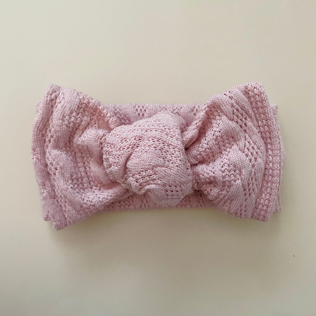 pink chunky cable knit top knot