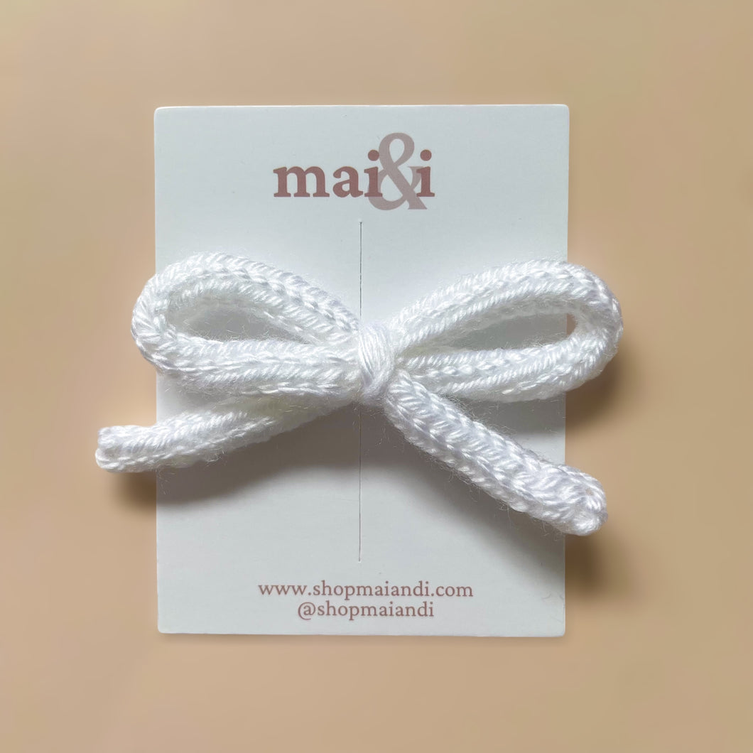 white crochet bow